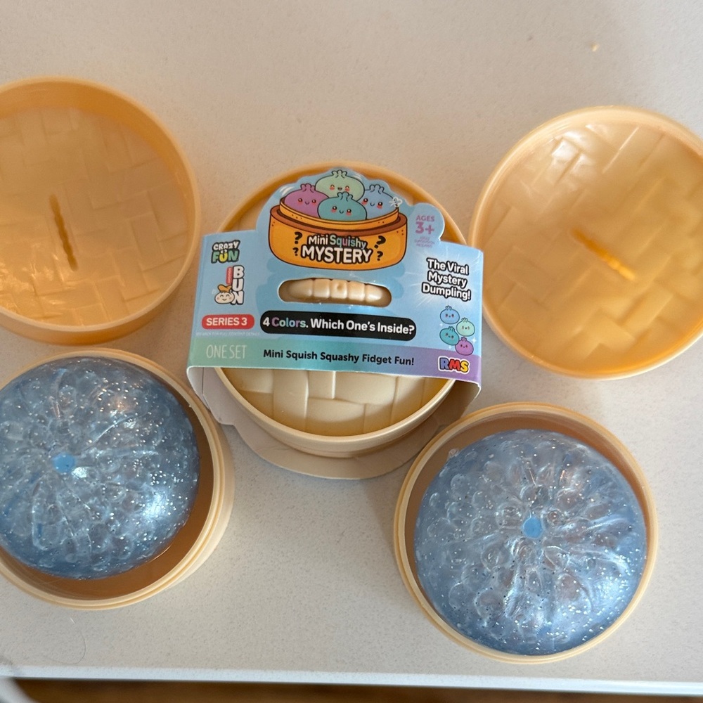 Mini Squishy Mystery Dumpling Fidget Toy - Light Blue Glitter